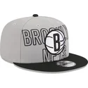 grau-schwarze-snapback-cap-9fifty-draft-edition-2023-der-brooklyn-nets-nba-von-new-era