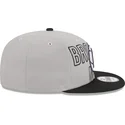 grau-schwarze-snapback-cap-9fifty-draft-edition-2023-der-brooklyn-nets-nba-von-new-era