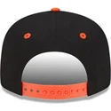 schwarze-und-orangefarbene-snapback-kappe-9fifty-von-daffy-duck-looney-tunes-von-new-era