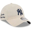 new-era-curved-brim-navy-blue-logo-9twenty-linen-spring-training-fan-pack-2025-new-york-yankees-mlb-beige-adjustable-cap